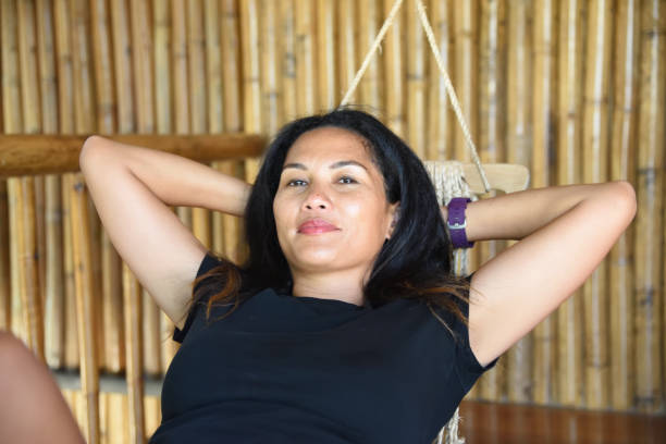 Confident Filipina embracing midlife with energy and glow