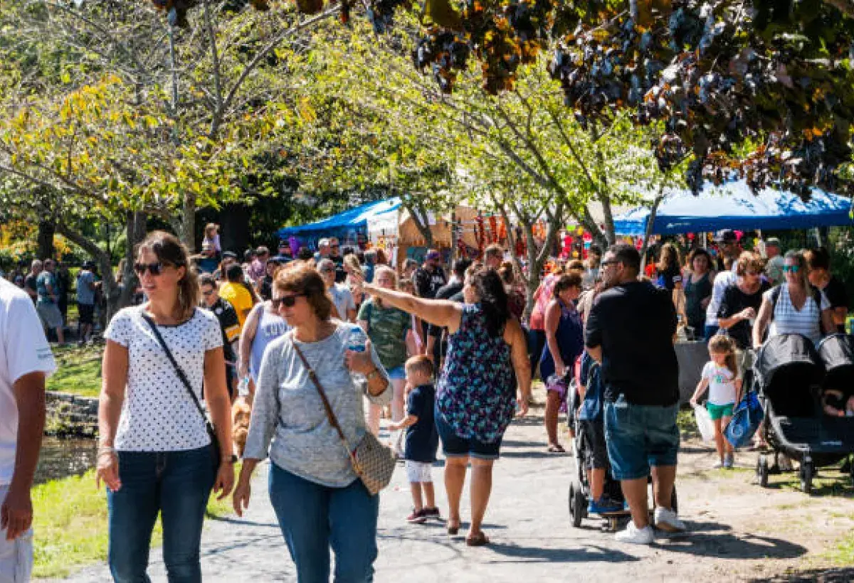 Community celebrating pawpaw fruit at annual festival