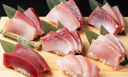 Assorted tuna cuts from otoro to akami displayed for sushi preparation