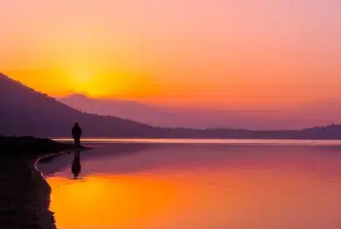 Sunrise reflection symbolizing the inner calm of joy.