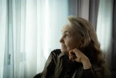 Elderly Woman in Reflection – Symbol of Global Aging Crisis