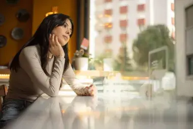 Person embracing a moment of quiet presence in a busy world