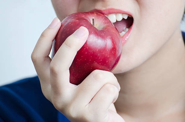 Eating apples helps clean your teeth naturally