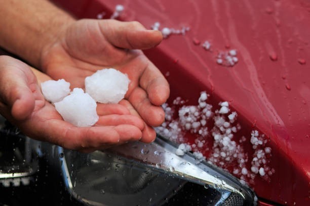 What is the frozen rain that forms in layers and can damage cars?