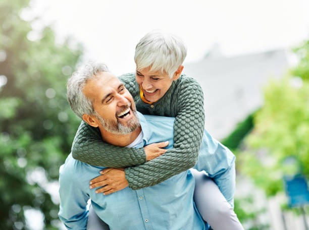 What percentage of people 65+ report being “very happy” or “pretty happy,” according to surveys?