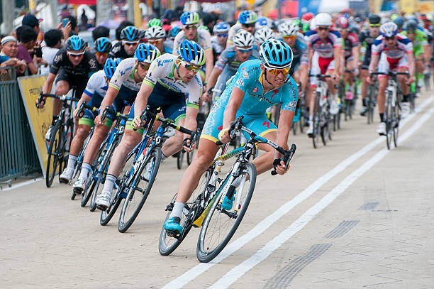 What do cyclists call the main group of riders in a race?